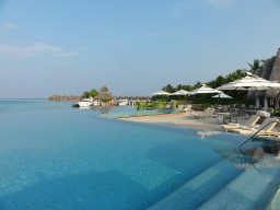 Pool area - The beautiful swimming pool is almost connected to the ocean. You decide where you wanna go for a swim!